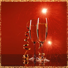 two glasses on champagne and party favours
